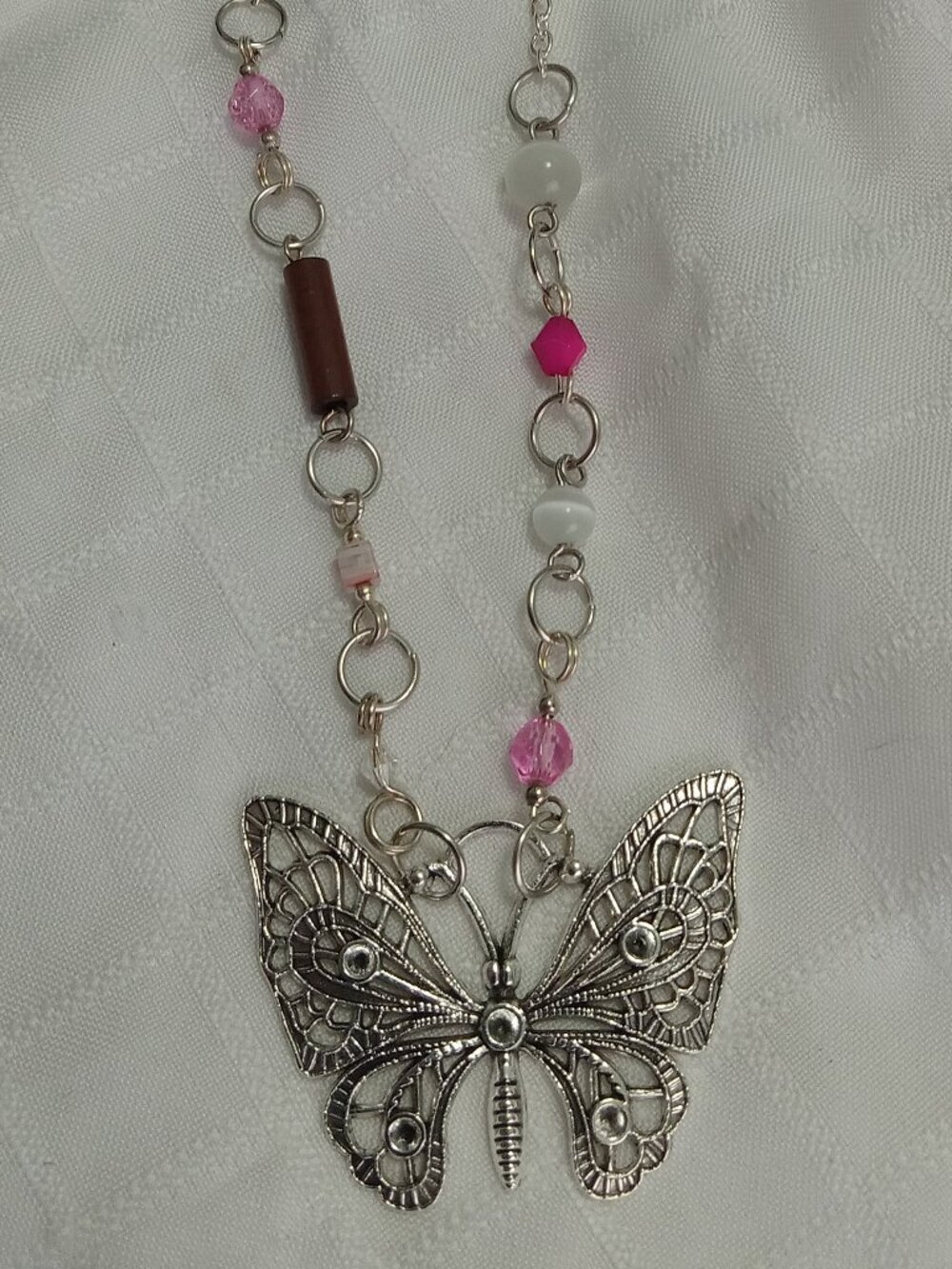 A pretty, minimalist, asymmetrical, reversible handmade necklace